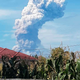 A giant plume of volcanic ash rises from Mount Soputan, seen from the town of Tomohon in northern Sulawesi.